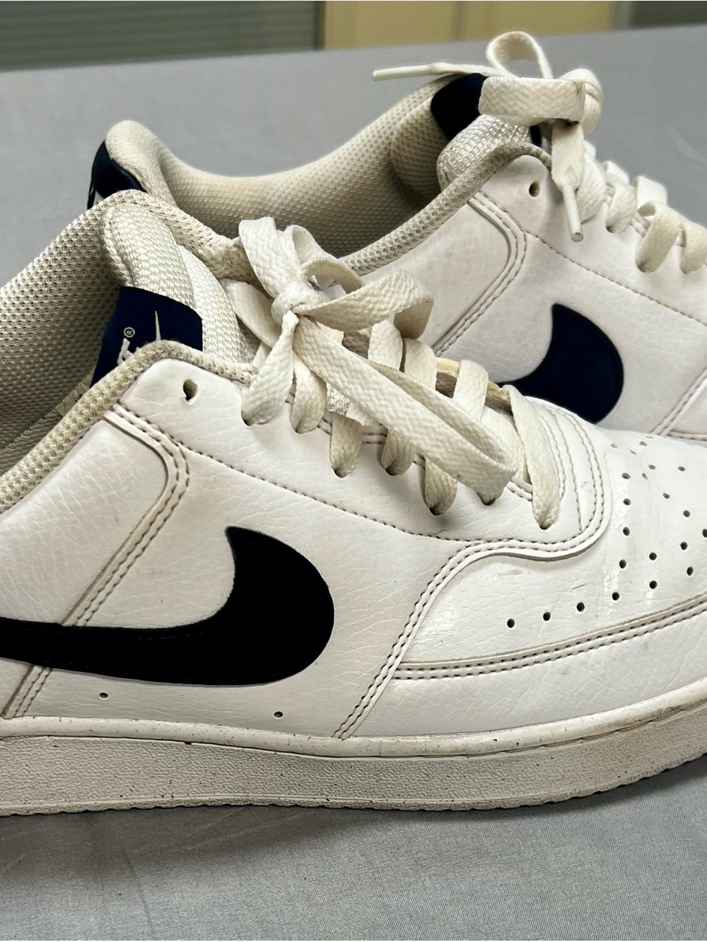 Nike White Low-Top Sneakers with Black Swoosh